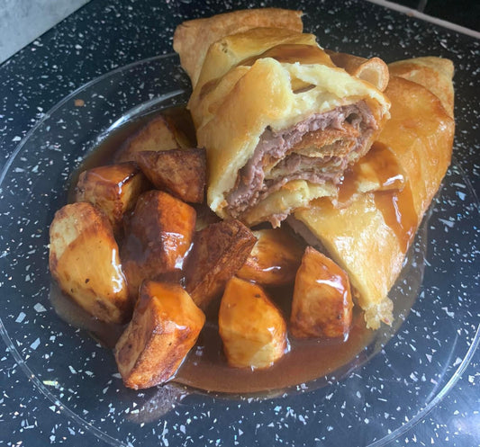 GIANT YORKSHIRE PUDDING WRAP WIT PORK AND STUFFING COMES WITH ROAST POTATOES AND GRAVY